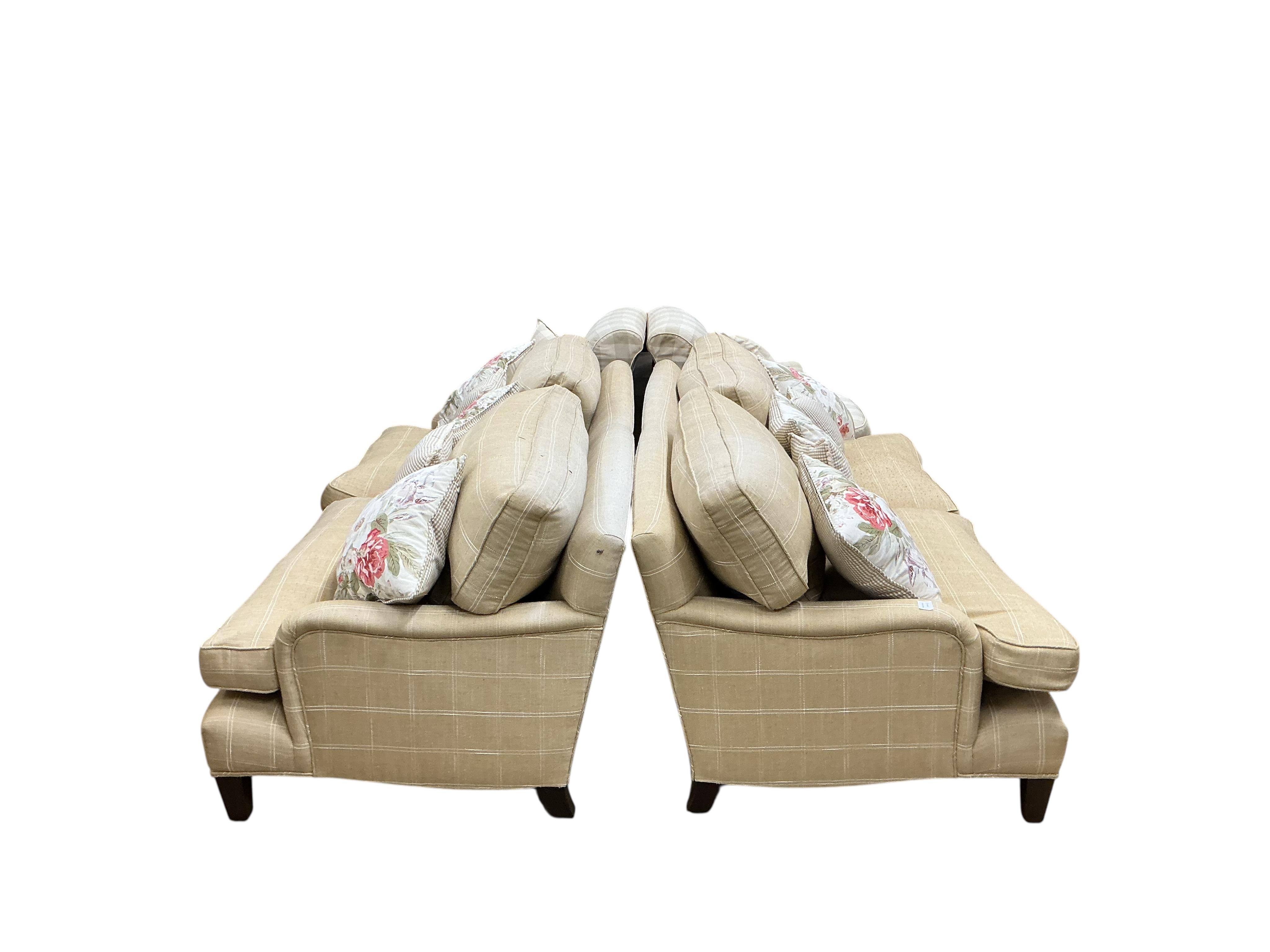 A pair of large grey and white squared upholstered settees, width 200cm, depth 90cm, height 84cm and a pair of matching armchairs
